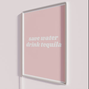 Quirky Neon Bar Decor with Humorous Save Water Drink Tequila Message