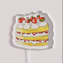 Load image into Gallery viewer, Vibrant neon dessert display decoration with semi-realistic strawberry shortcake design