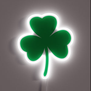 Irish-themed neon sign featuring vibrant green and colorful light effects.