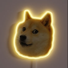 Load image into Gallery viewer, Neon sign of the Doge meme face with a yellow glow.

