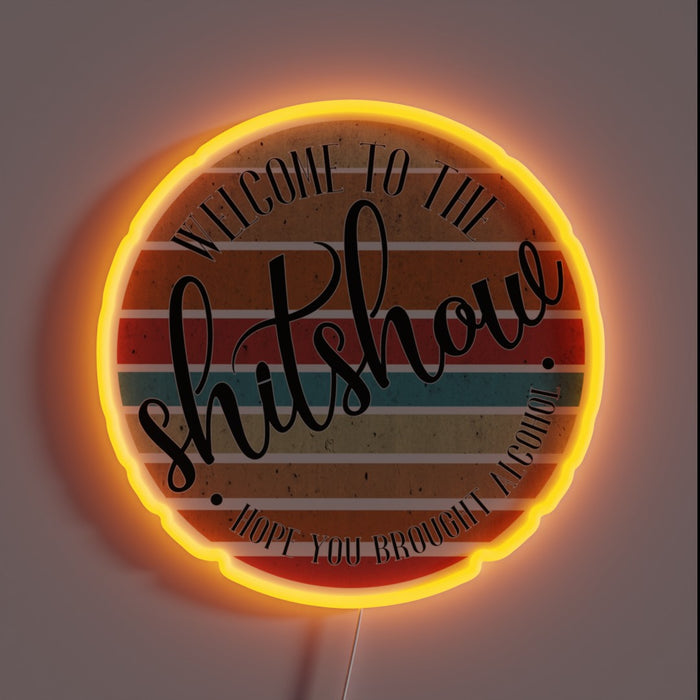 Gaudy, eye-searing neon sign reads 'Shit Show' in bold letters