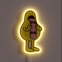Load image into Gallery viewer, Skater vibes with a twist of weird — this neon character is straight-up licking a skateboard. Bold, goofy, and totally unique. For the wall that dares to be different. 🛹👅✨