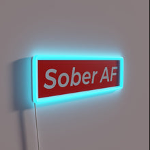 Load image into Gallery viewer, Neon sign declaring sobriety with bold, colorful LED display style.