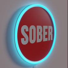Load image into Gallery viewer, Sober living support logo illuminated with vibrant RGB neon colors.