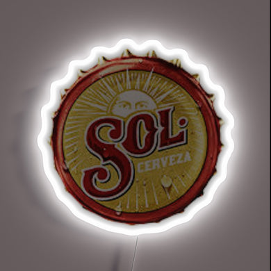 Vibrant LED sign featuring a stylized bottlecap design with colorful glow.