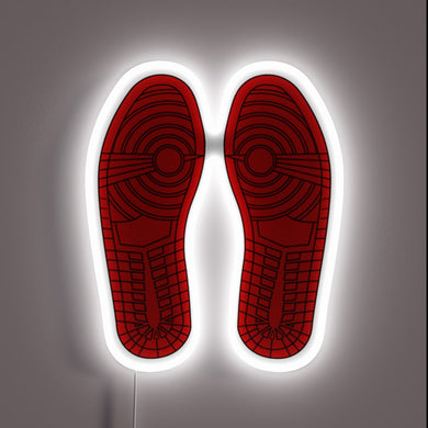 Those iconic outsoles are unmistakable—Air Jordan 1 vibes all day. The white neon outline gives it that gallery sneakerhead energy. 🔥👟🖼️