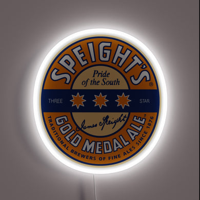 Speight's Gold Medal Ale logo with three orange stars, blue and orange circular design, and white neon glow.
