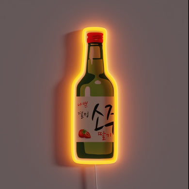 Strawberry soju neon sign with orange glow.
