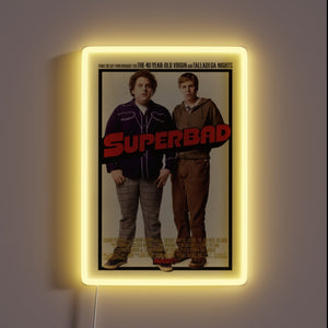 Bring legendary laughs to your wall with this **Superbad** neon-framed poster. 🍻✨ The ultimate tribute to awkward teenage adventures, iconic one-liners, and unforgettable high school nights. Perfect for movie buffs, man caves, or your next party backdrop.