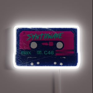 Retro cassette tape neon sign with “SYNTHWAVE” in bold — a must-have for vaporwave or retrowave aesthetics.
