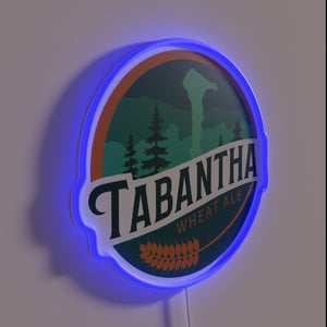 Bright Neon Sign Featuring Vibrant Logo of Tabantha Wheat Ale