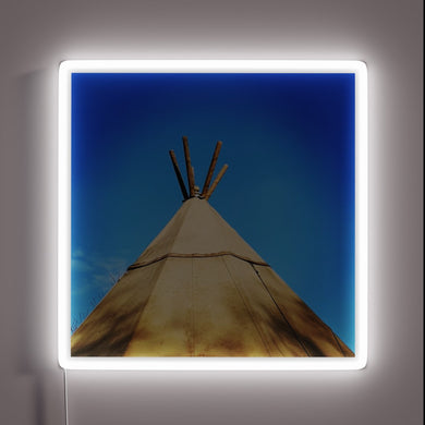 Glowing tribal teepee shape illuminated by vibrant RGB neon lights
