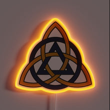 Load image into Gallery viewer, Eye-catching muted neon sign featuring Celtic-inspired triquetra symbol design.