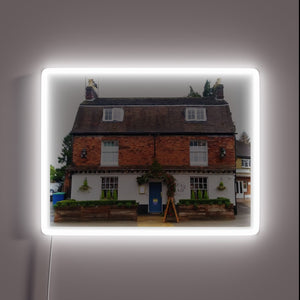 Traditional English Pub Sign with Colorful RGB Neon Illumination