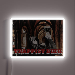 Trappist Monk Illuminates Abbey Sanctuary with Vibrant Neon Sign Design