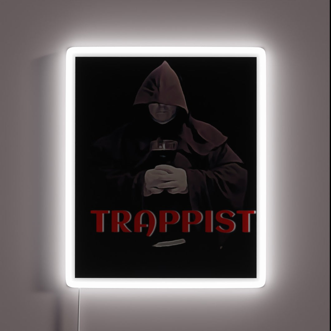 Vibrant LED light art featuring Trappist monk in radiant colors.