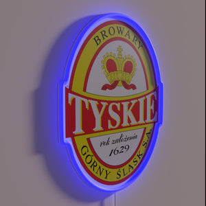 Vibrant RGB neon sign featuring Tyskie Polish beer logo prominently.