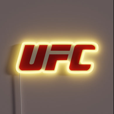 Red UFC logo neon sign with yellow glow.