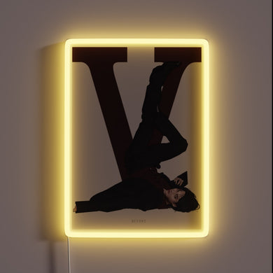 Vibrant neon sign with customizable RGB colors in a striking V shape.