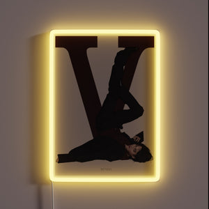 Vibrant neon sign with customizable RGB colors in a striking V shape.