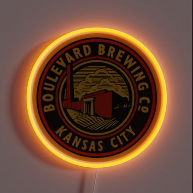 Alt text: Neon-lit round sign with 