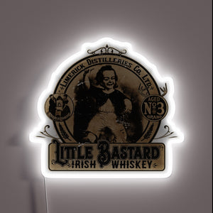 Retro illuminated whiskey advertisement with colorful neon signage glow effect.