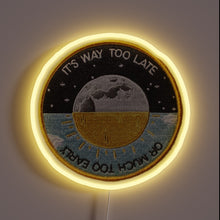 Load image into Gallery viewer, Alt text: Circular neon patch sign with moon and sun illustration, reading “It’s Way Too Late or Much Too Early.”
