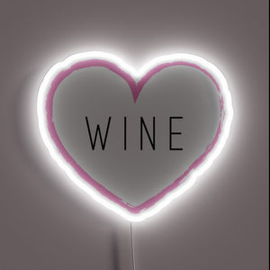 Romantic wine display with vibrant RGB neon heart shaped illumination.
